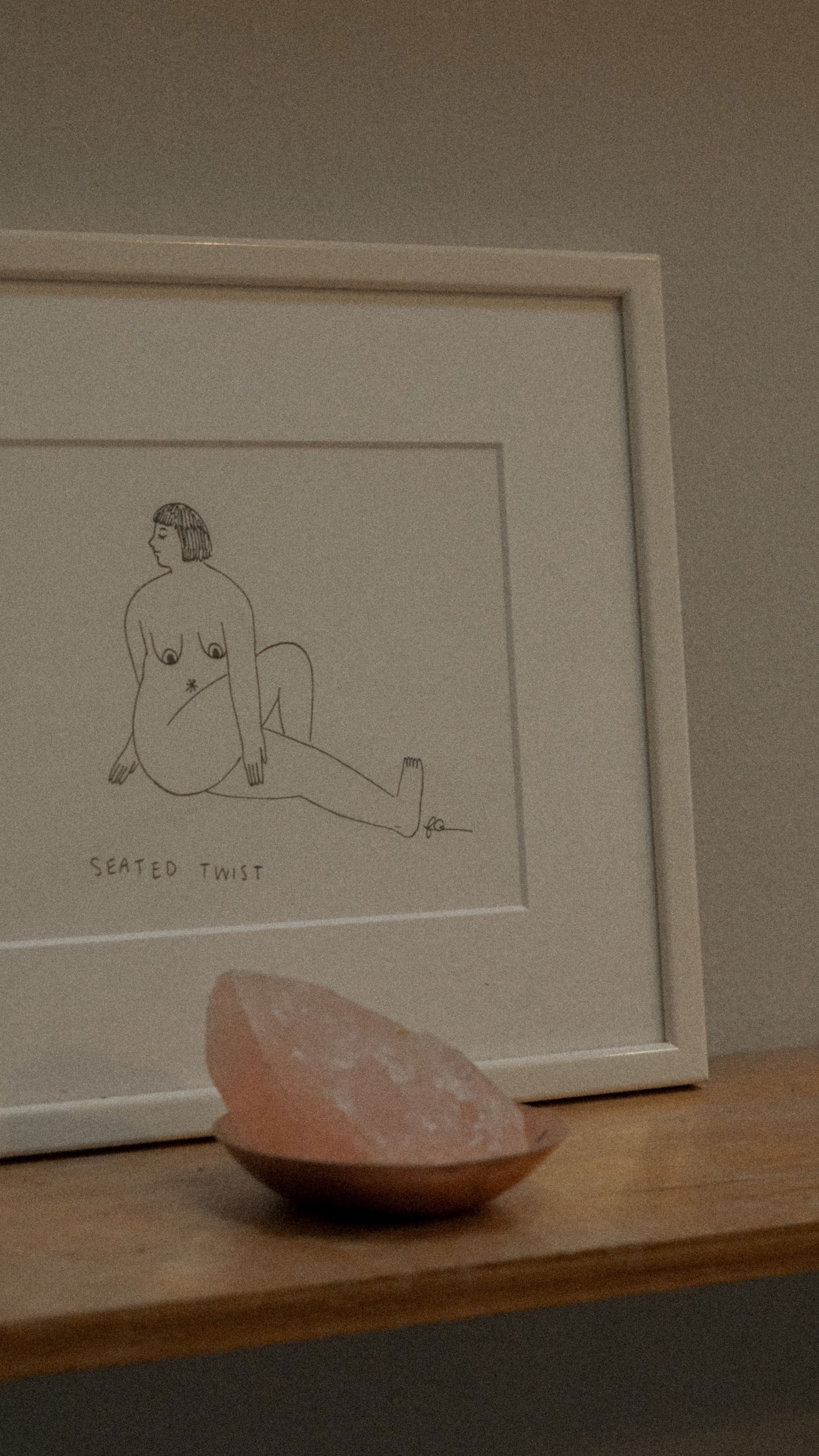 Line drawing on a side table with crystal