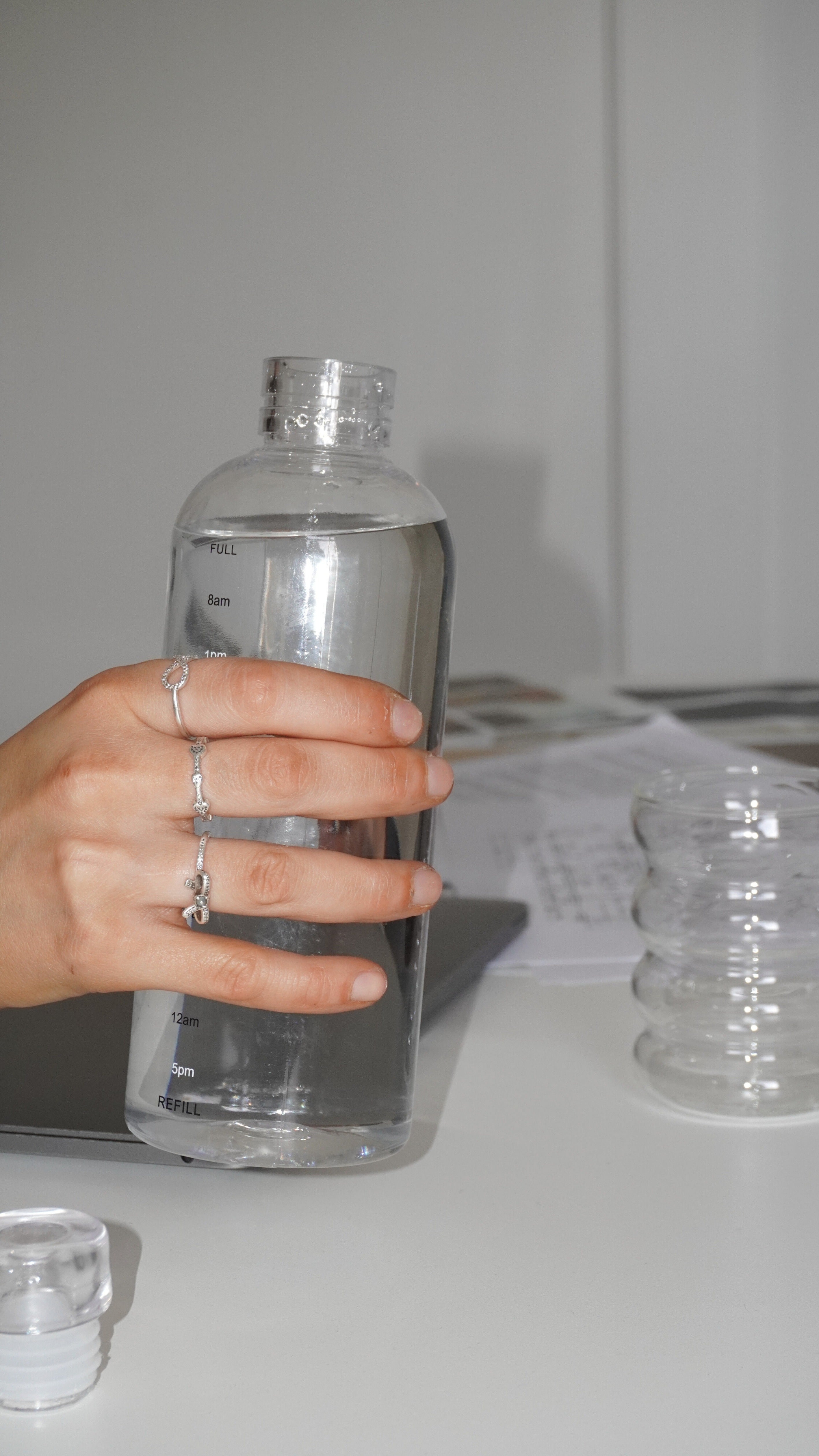 Woman's hand holding bottle of water