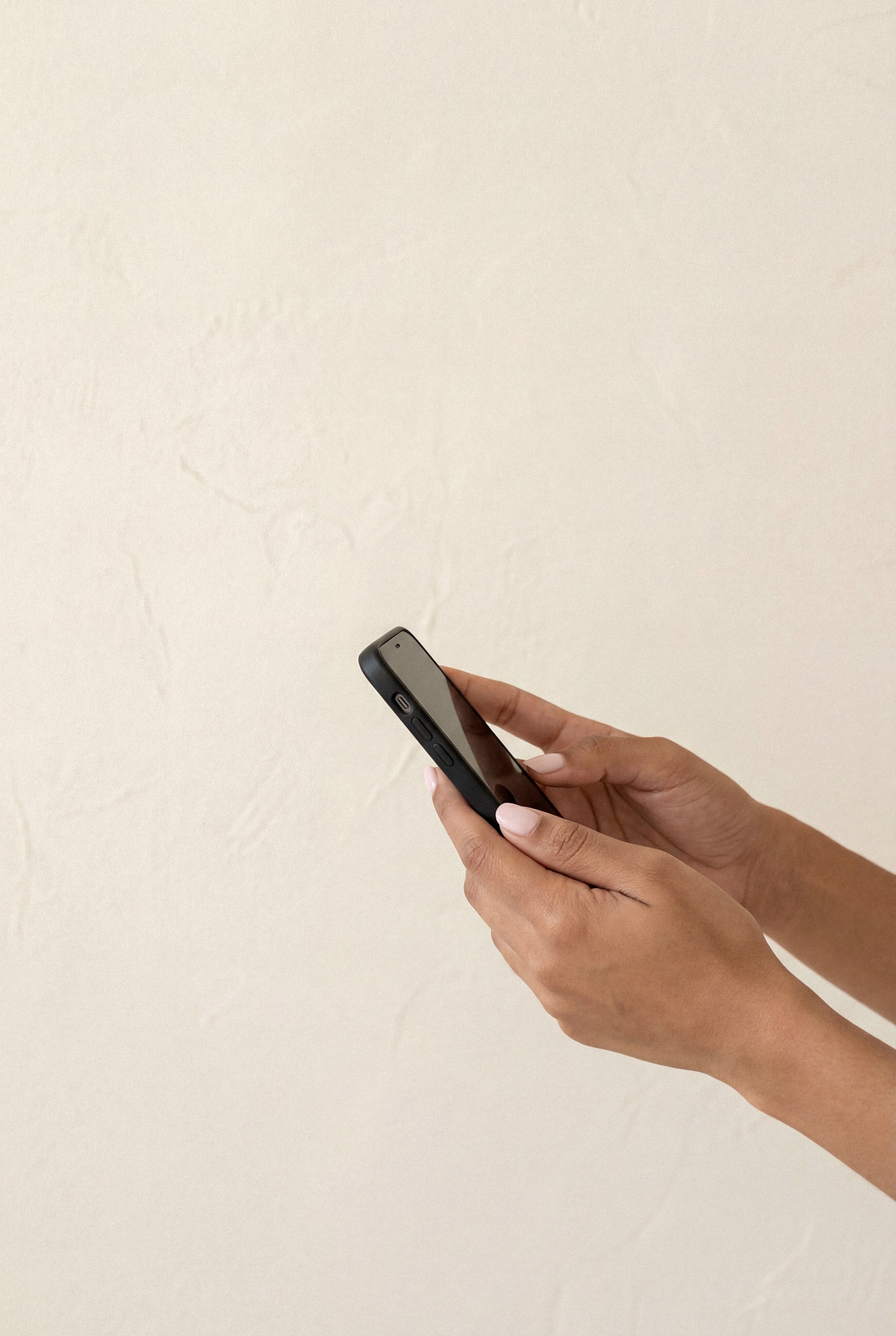 Woman's hands holding phone