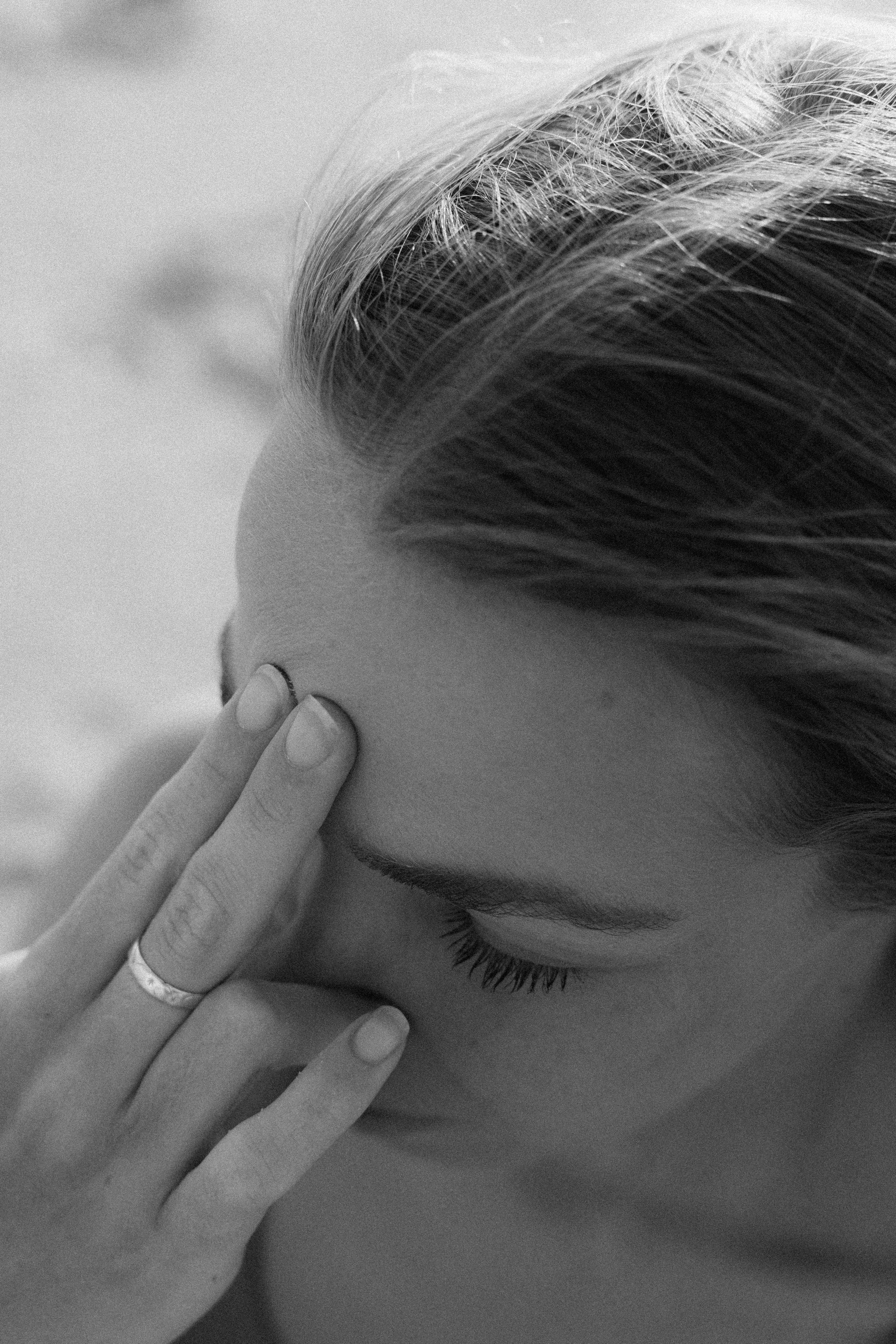 Woman holding face breathing