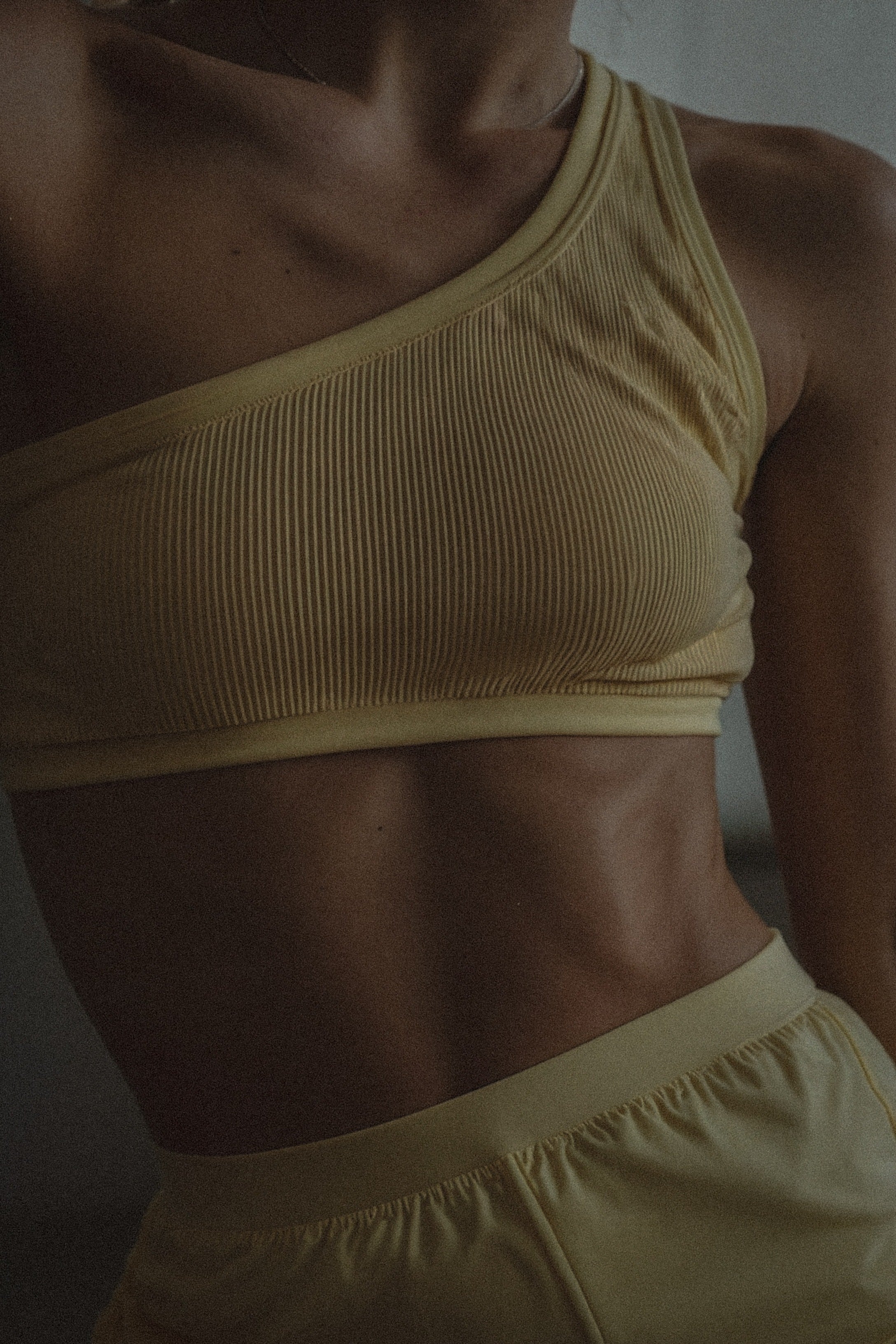 Close up of woman wearing yellow activewear